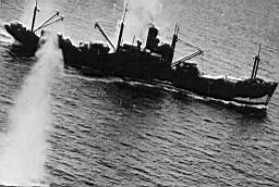 P029441 - Japanese cargo ship under attacked during the Battle of the Bismarck Sea, 90th B.S., 3rd B.G., 5th A.A.F., 3 March, 1943..jpg
